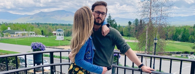 Girlfriend kissing boyfriend with New Hampshire mountains in the background - Tips for Finding the Perfect Significant Other